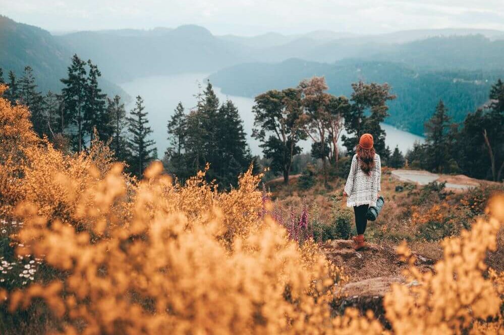 woman on a hike looking at river
